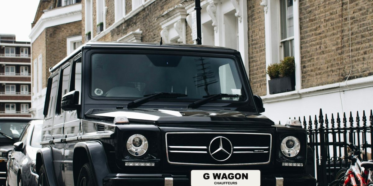 Black Mercedes G-Wagon with G Wagon Chauffeurs plate on a London street